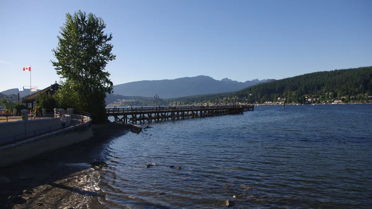 The pier at Rocky Point Park in Port Moody, with the mountains across the inlet