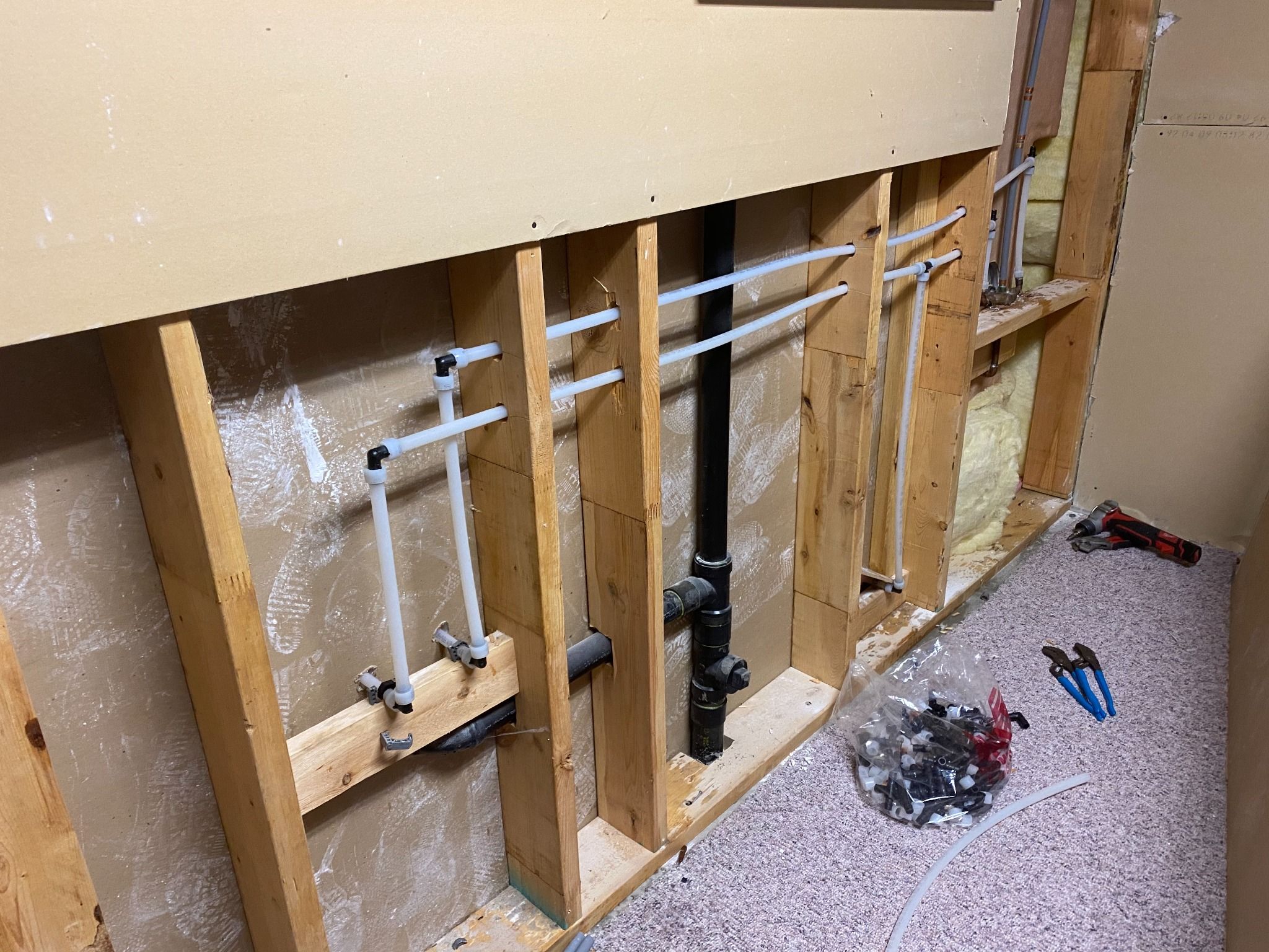 New replacement water lines in the same wall during a Poly-B repipe in North Vancouver